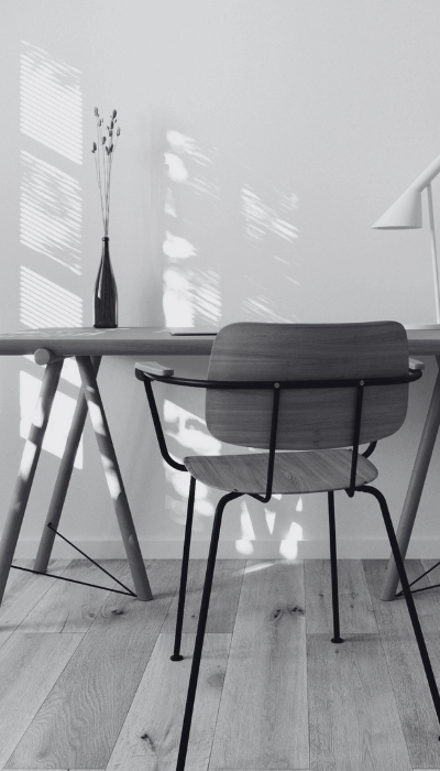 Office desk with lamp and vase