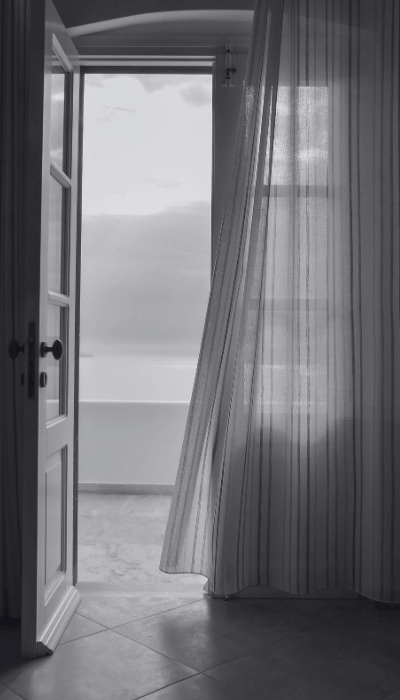 Luxury hotel ambiance: Open door with ocean view balcony